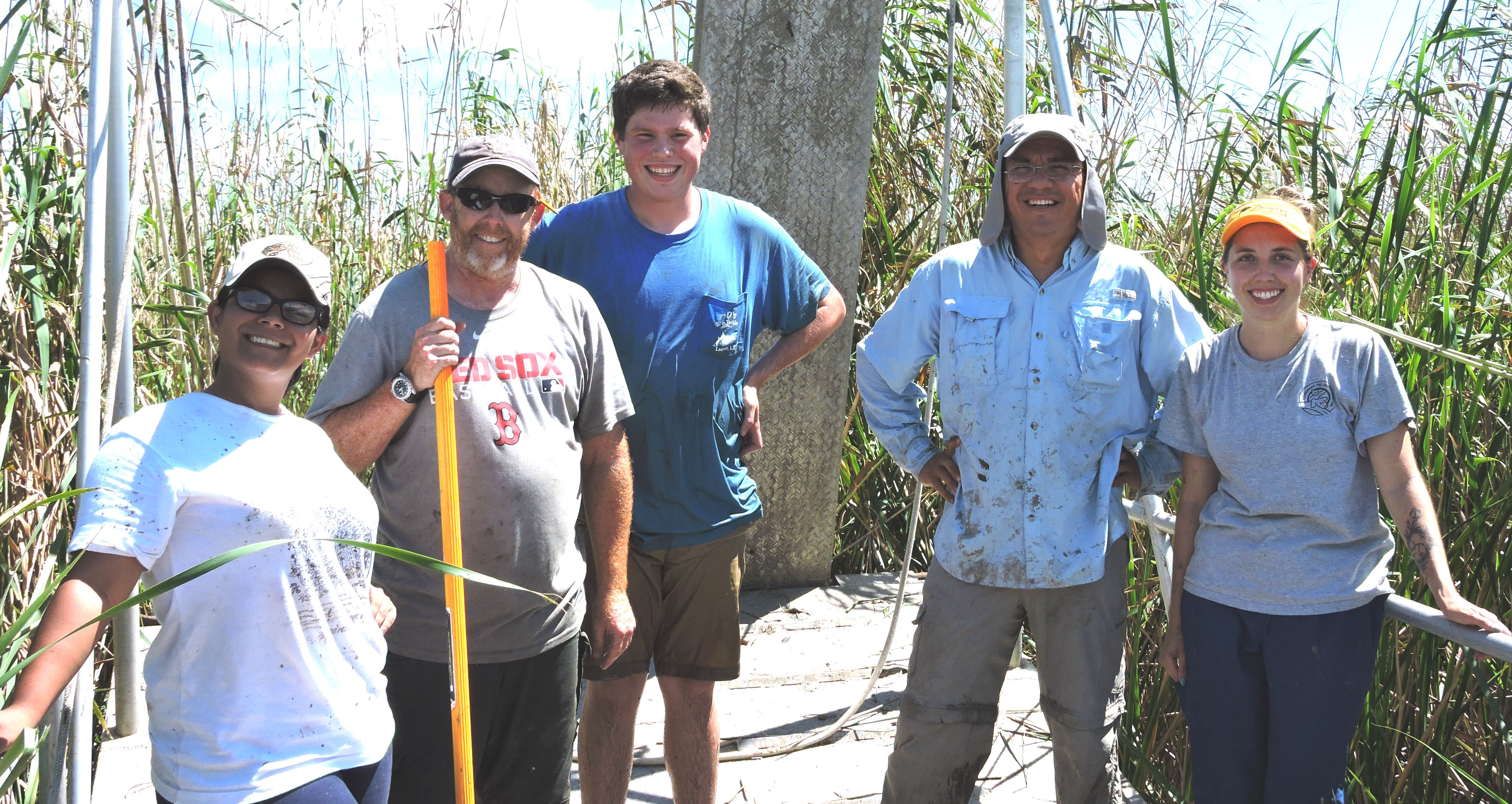 five scientists stand by cane.jpg thumbnail